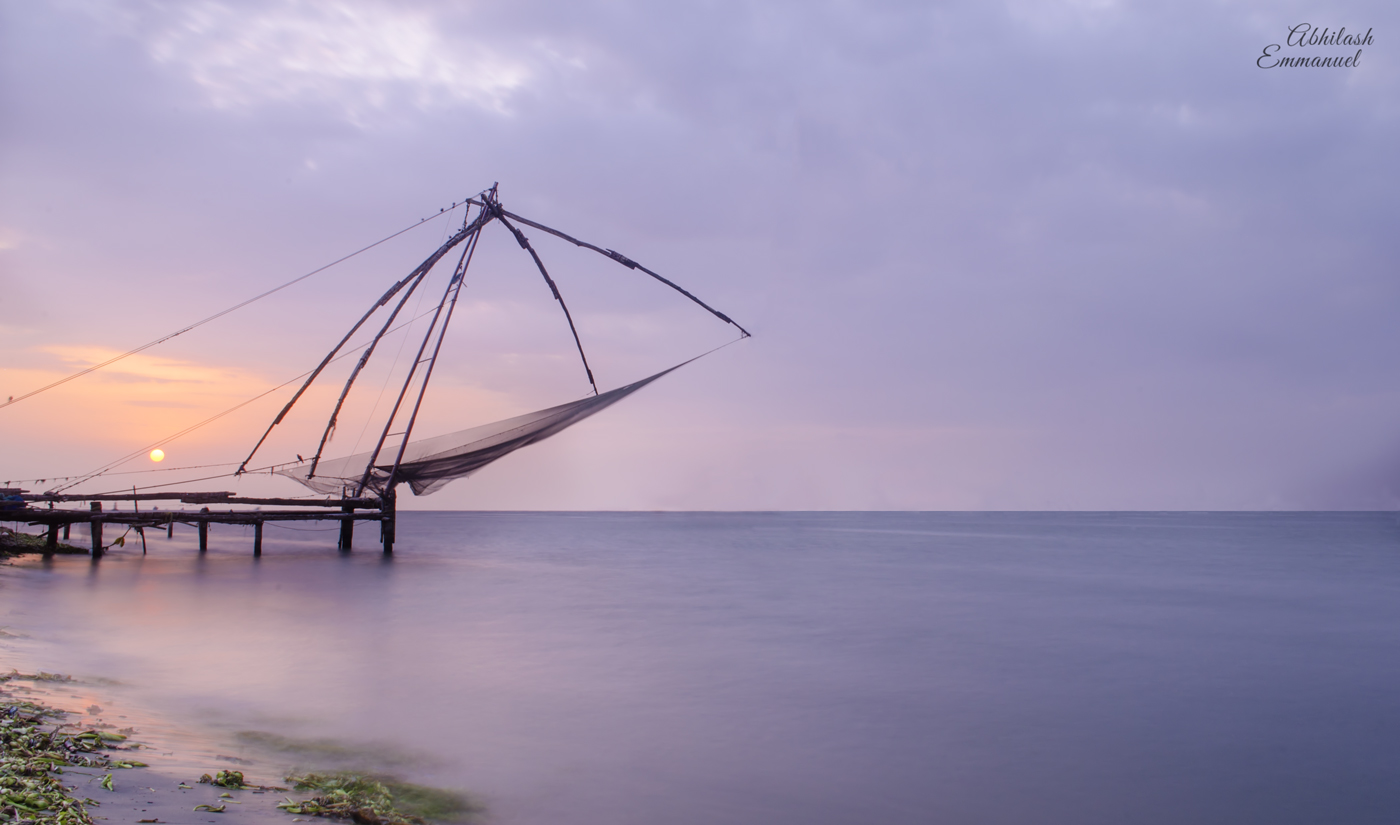 Chinese fishing nets silhouetted at dusk in Kochi